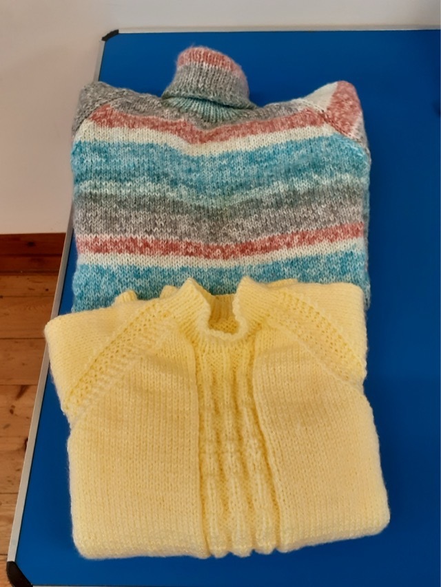 two beautifully knitted jumpers by Pat